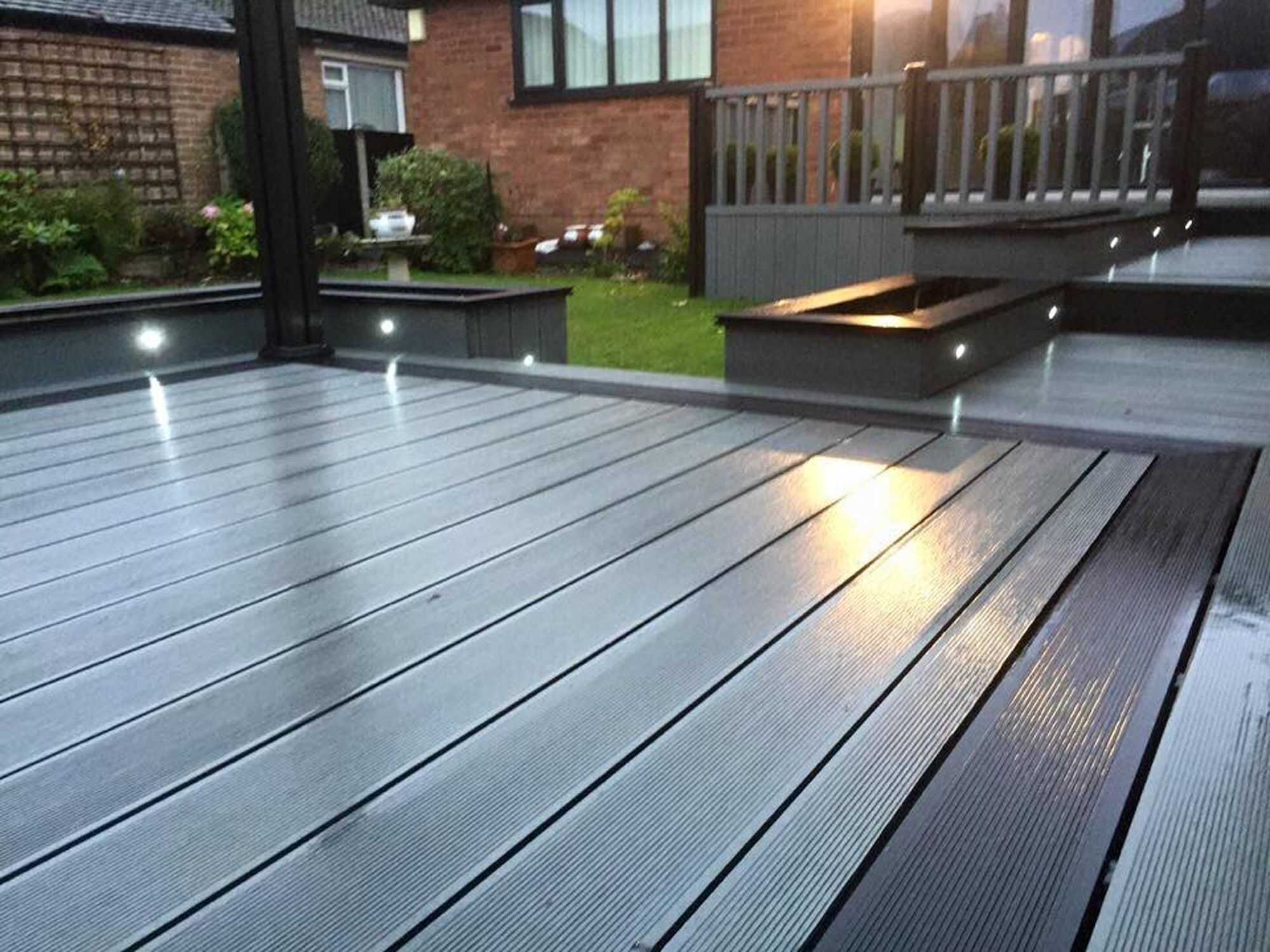 Close view of composite decking boards showing consistent gapping and clean board ends