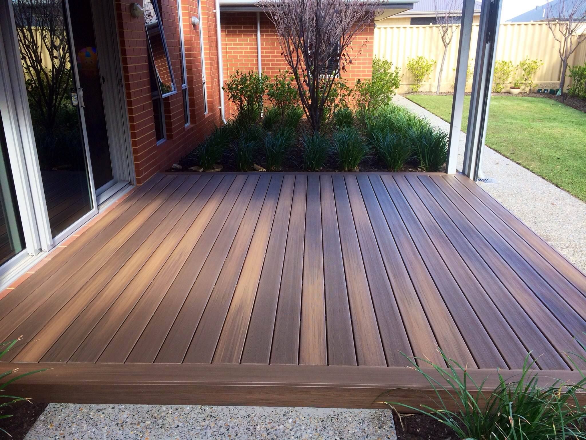 Finished timber deck integrated into a landscaped garden with clean edge detailing