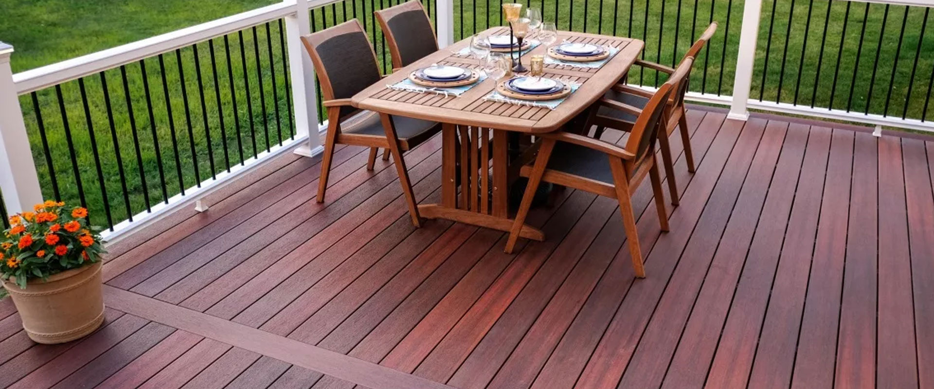 Restored timber deck with outdoor dining furniture set on refinished boards